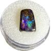 This is a picture of an thumbnail size opal, with galaxy-like coloration.