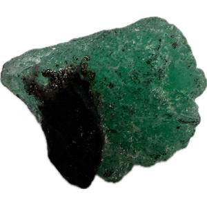 This is a picture of a deep green raw emerald.