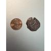 pirate coin hand hammered using copper from spain. this shipwreck coin is from the 1600's