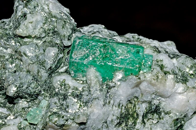 This picture shows a light green emerald embedded within one of Muzo Mine's rocks.
