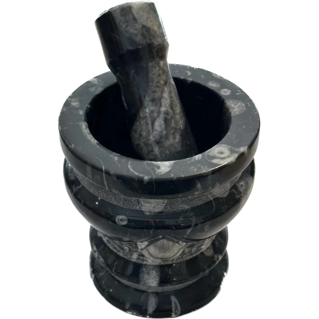 This is a picture of a mortar and pestle made out of orthoceras fossils and marble.