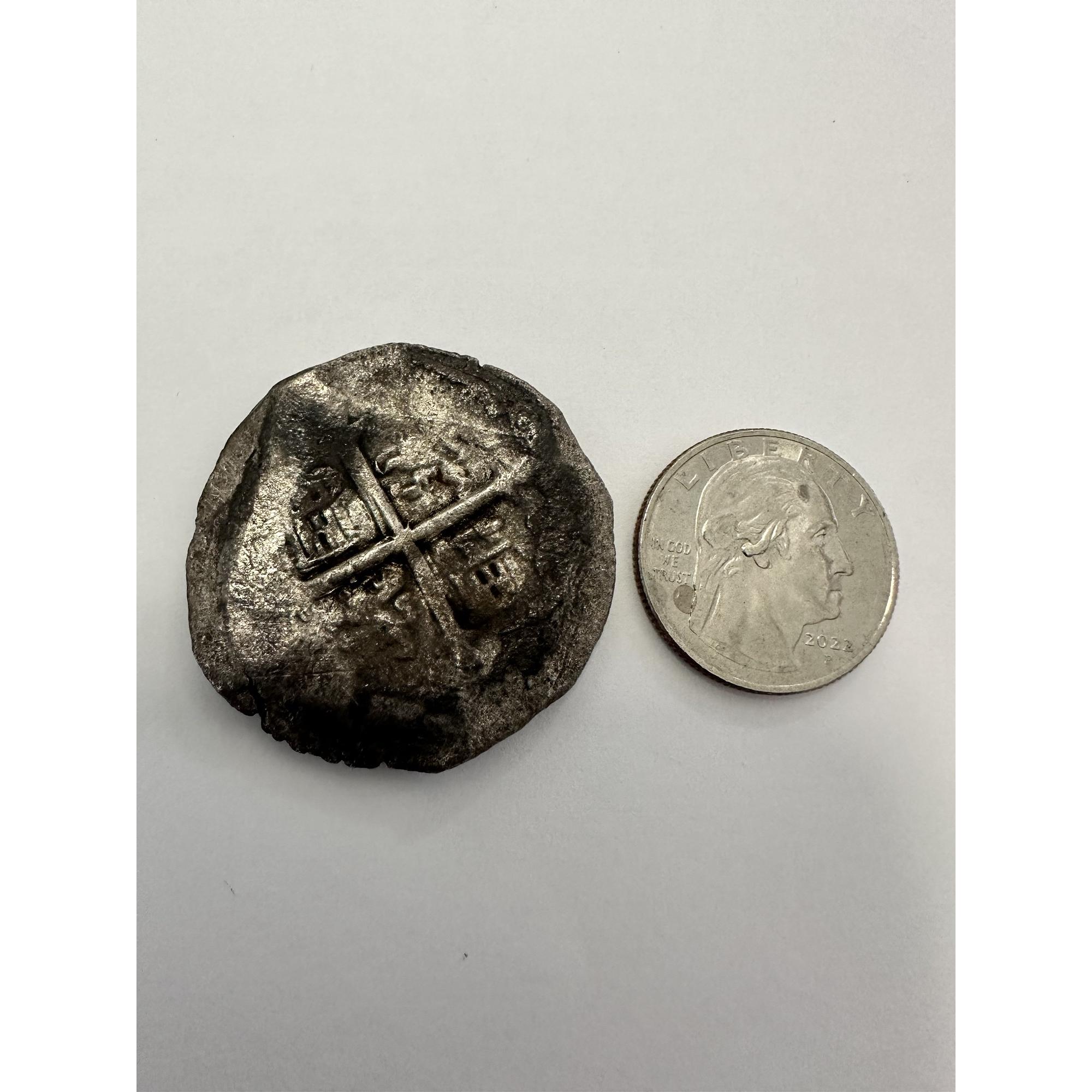 Concepcion shipwreck coin, 8 reale compared with a quarter